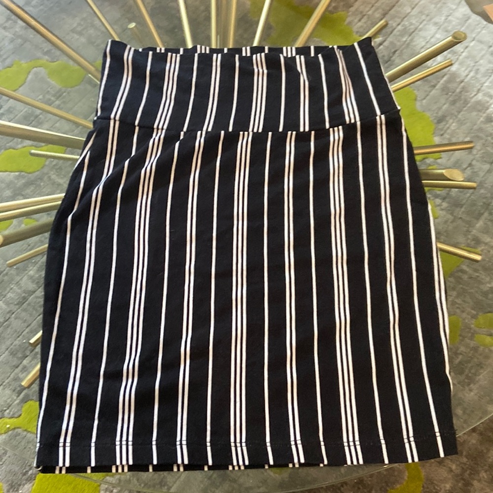 This is a woman’s xs Charlotte Russe skirt. It is black with white stripes